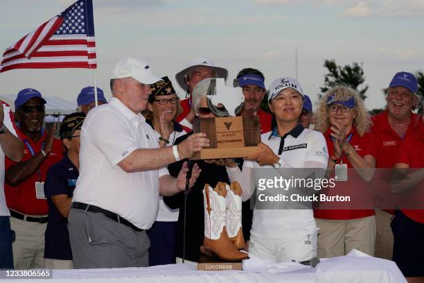 Jin Young Ko of Korea receives the trophy after winning the Volunteers of America Classic at the Old American Golf Club on July 4, 2021 in The...