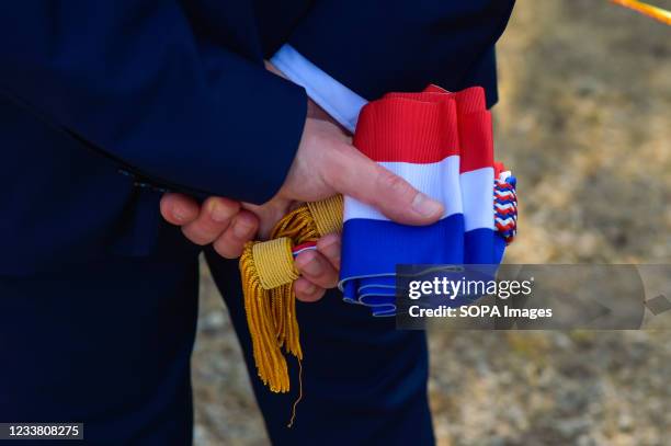 Fabien Matras, deputy LREM of the 8th district of Var holds his official tricolor sash during the demonstration. The firefighting teams carry out a...