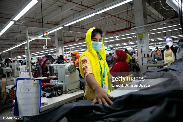 Garment worker works at a factory during a countrywide lockdown to try to contain the spread of Covid-19 on July 5, 2021 in Dhaka, Bangladesh....