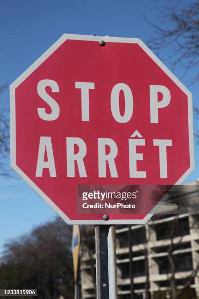 Stop sign in both French and English languages in Toronto, Ontario, Canada.