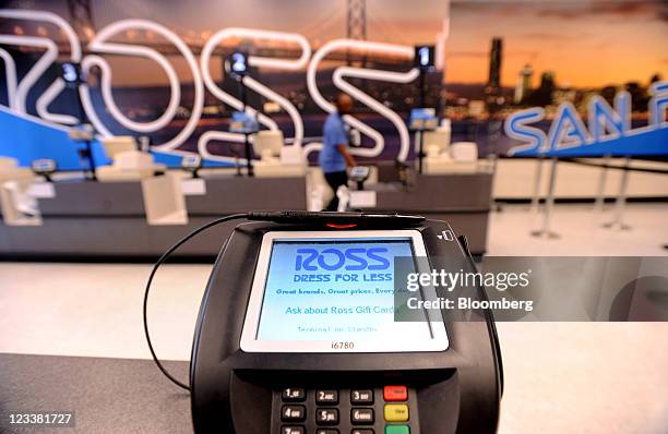 Ross Stores Inc. Signage is displayed on a card reading device at a location in San Francisco, California, U.S., on Wednesday, Aug. 31, 2011. Ross...