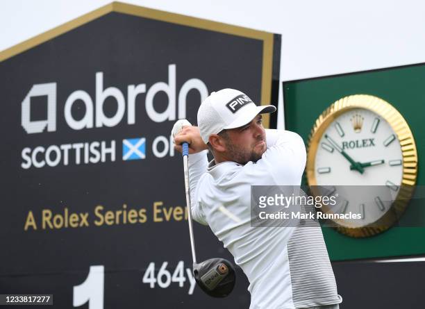 Corey Conners of Canada plays his tee shot to the first hole during a practice day prior to the abrdn Scottish Open at The Renaissance Club on July...