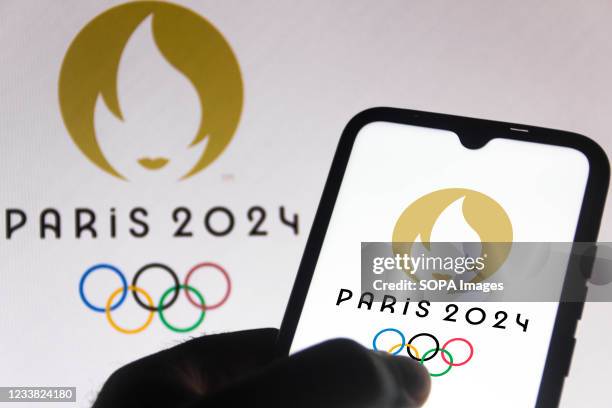 In this photo illustration the Paris 2024 Olympic Games logo is seen on a smartphone screen.