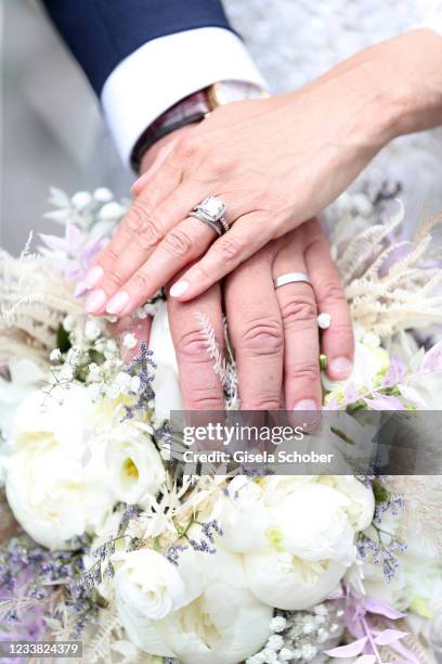 Rings of Peter Olsson and Claudelle Deckert during the wedding ceremony of Claudelle Deckert and Peter Olsson on July 5, 2021 at Faehrhuette in...