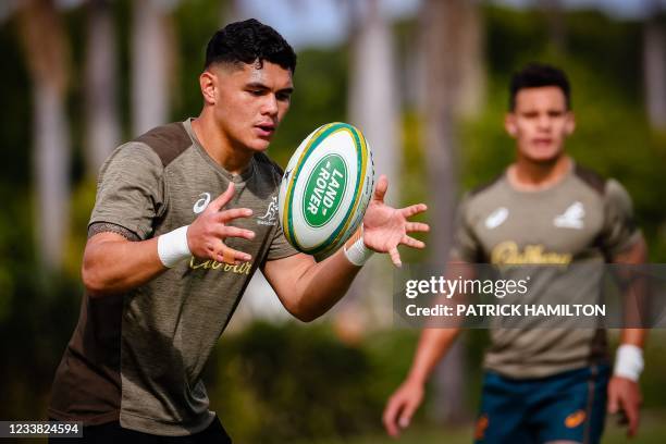 Australia's rugby player Noah Lolesio catches the ball during a captain's run at Sanctuary Cove in Gold Coast on July 06 ahead of the first Test...
