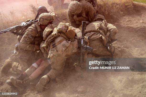 In this file photo taken on October 13, 2012 US Army soldiers attached to 2nd platoon, C troop, 1st Squadron , 91st U.S Cavalry Regiment, 173rd...