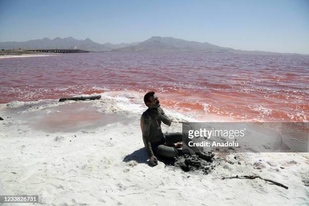 People enjoy at the Lake Urmia, one of the biggest saltwater lakes in the world located in the northwest of Iran, as recovering works continue due to...