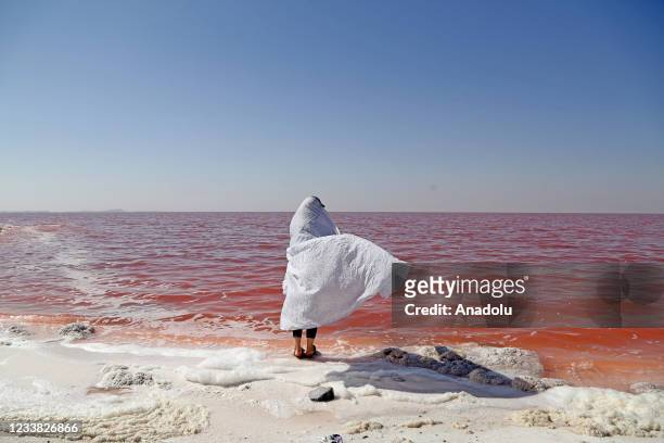 Kid is seen at Lake Urmia, one of the biggest saltwater lakes in the world located in the northwest of Iran, as recovering works continue due to...