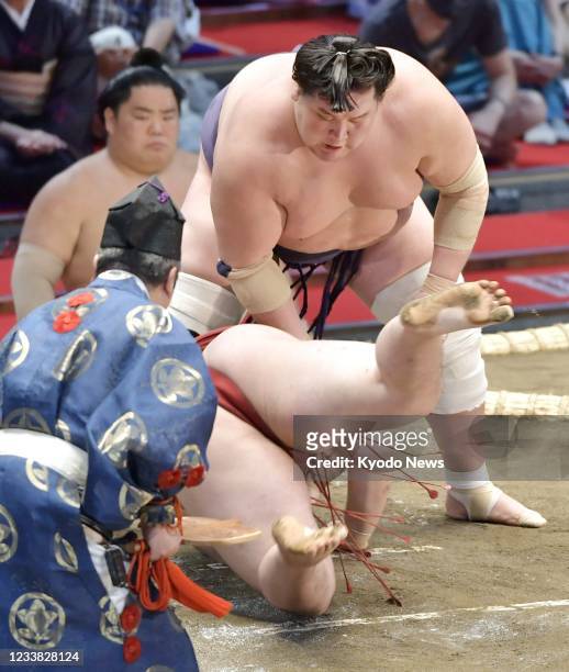 Ozeki Terunofuji defeats Takanosho on the third day of the Nagoya Grand Sumo Tournament at Dolphins Arena in Nagoya, central Japan, on July 6, 2021.