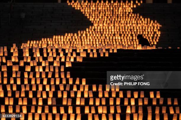 Around 2,000 candles are lit in front of Zojoji temple to mark the Tanabata or Japanese star festival in Tokyo on July 6, 2021.