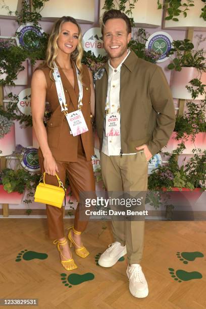Amelia Tank and Olly Murs pose in evian's VIP suite, certified as carbon neutral by The Carbon Trust, during day eight of The Championships at...