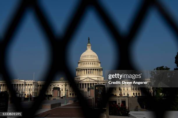 The U.S. Capitol Dome is seen through security fencing on July 6, 2021 in Washington, DC. According to recent media reports, the remaining fencing...