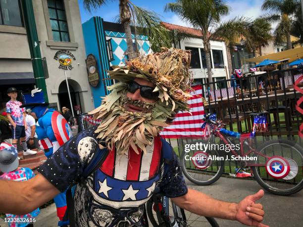 Huntington Beach, CA A reveler shows off their patriotic costume while parading around Main Street on the Fourth of July Sunday, July 4, 2021 in...