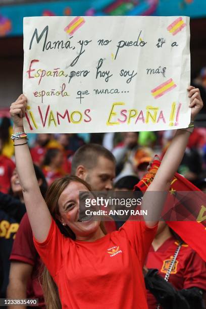 Spain supporter carries a placard ahead of the UEFA EURO 2020 semi-final football match between Italy and Spain at Wembley Stadium in London on July...