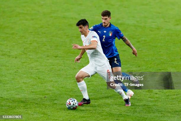 Gerard Moreno Balaguero of Spain and Giovanni Di Lorenzo of Italy battle for the ball during the UEFA Euro 2020 Championship Semi-final match between...