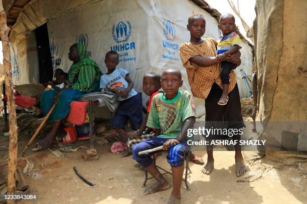 Rosa Ghobria , a South Sudanese refugee living at Sudan's al-Takamol camp, on the outskirts of the capital Khartoum, is pictured with her children on...