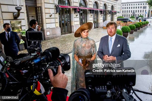 King Willem-Alexander of The Netherlands and Queen Maxima of the Netherlands give a statement outside their hotel on the shooting attack on Dutch...