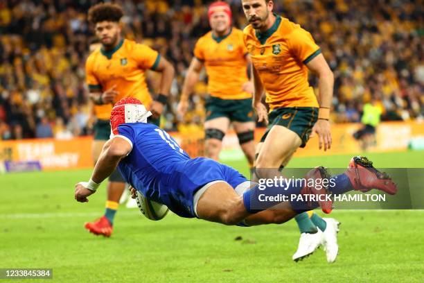 France's Gabin Villiere dives in to score a try during the first of the three rugby union Test matches between Australia and France at Suncorp in...