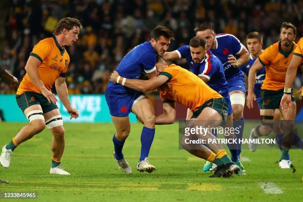 France's Baptiste Couilloud fights for the ball during the first of the three rugby union Test matches between Australia and France at Suncorp in...