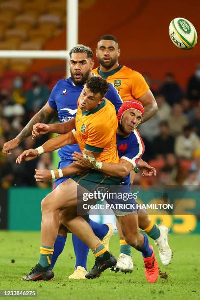 Australia's Tom Banks is tackled by France's Gabin Villiere during the first of the three rugby union Test matches between Australia and France at...