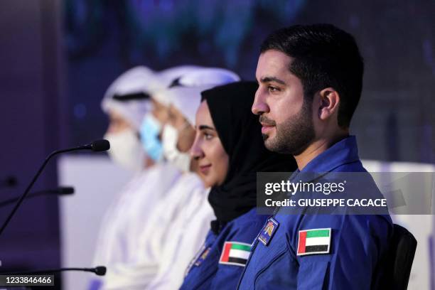 Astronauts Mohammad al-Mulla and Nora al-Matrooshi look on during a press conference in Dubai on July 7, 2021. - The UAE's Nora al-Matrooshi is the...