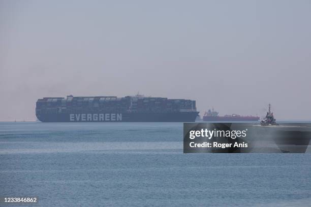 Evergreen ship is seen leaving Suez Canal to the Mediterranean after the signing of the settlement contract, on July 7, 2021 in Ismailia, Egypt. The...