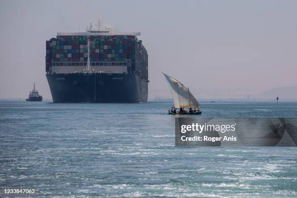 Evergreen ship is seen leaving Suez Canal to the Mediterranean after the signing of the settlement contract, on July 7, 2021 in Ismailia, Egypt. The...