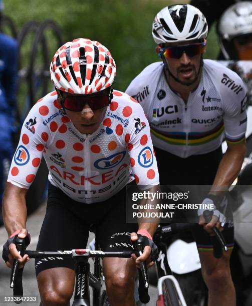 Team Arkea - Samsic's Nairo Quintana of Colombia wearing the best climber's polka dot jersey rides next to Team Deceuninck Quickstep's Julian...