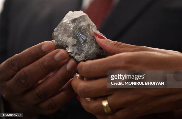 Member of the Botswana cabinet holds a 1,174-carat diamond in Gaborone, Botswana, on July 7 that the Lucara Botswana found during an eleven day...