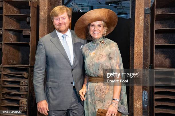 King Willem-Alexander of The Netherlands and Queen Maxima of The Netherlands step through the entrance door of former night club 'Tresor' during a...