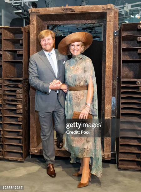 King Willem-Alexander of The Netherlands and Queen Maxima of The Netherlands step through the entrance door of former night club 'Tresor' during a...