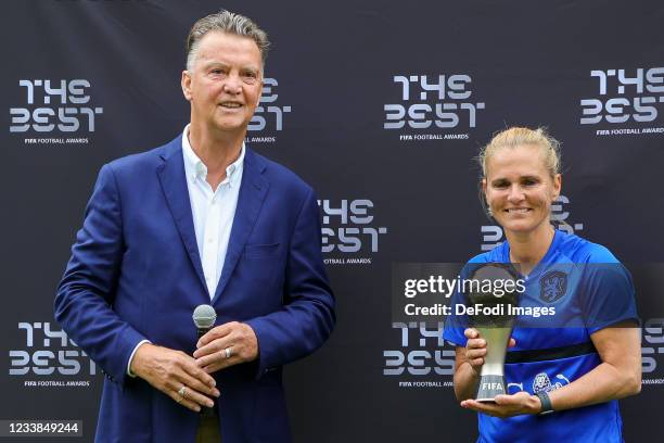 Louis van Gaal and Sarina Wiegman of Netherlands smiles during the training session of Netherlands Women at Mac3Park Stadium on July 03, 2021 in...