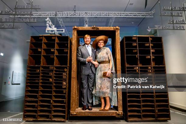 King Willem-Alexander of the Netherlands and Queen Maxima of The Netherlands step through the entrance door of former night club 'Tresor' during a...