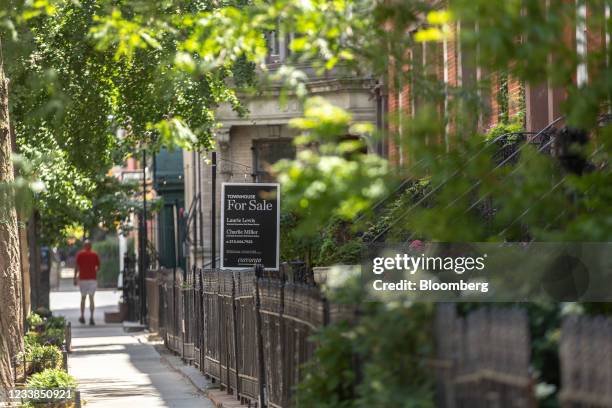 For Sale" sign in front of a property in the Chelsea neighborhood of New York, U.S., on on Sunday, July 4, 2021. New York's residential market is...