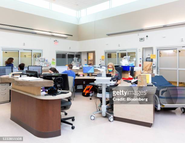 Healthcare workers in the emergency room at Cox Medical Center South in Springfield, Missouri, U.S., on Monday, June 28, 2021. President Biden set a...