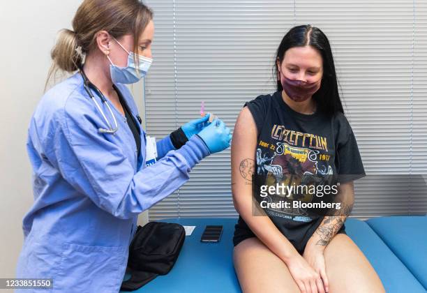 Healthcare worker after administering the Pfizer-BioNTech Covid-19 vaccine to a resident at the Jordan Valley Community Health Center in Springfield,...