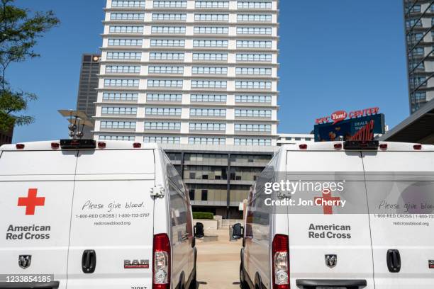 American Red Cross vehicles sit parked outside of the KFC YUM! Center during the Starts, Stripes, and Pints blood drive event on July 7, 2021 in...