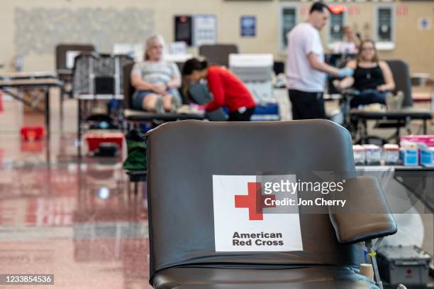 An empty donation table with the American Red Cross logo is seen at the KFC YUM! Center during the Starts, Stripes, and Pints blood drive event on...