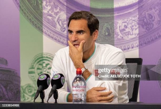 Switzerland's Roger Federer attends a press conference after losing to Poland's Hubert Hurkacz during their men's quarter-finals match on the ninth...