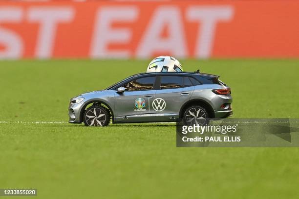 Remote control car delivers the match ball for the UEFA EURO 2020 semi-final football match between England and Denmark at Wembley Stadium in London...