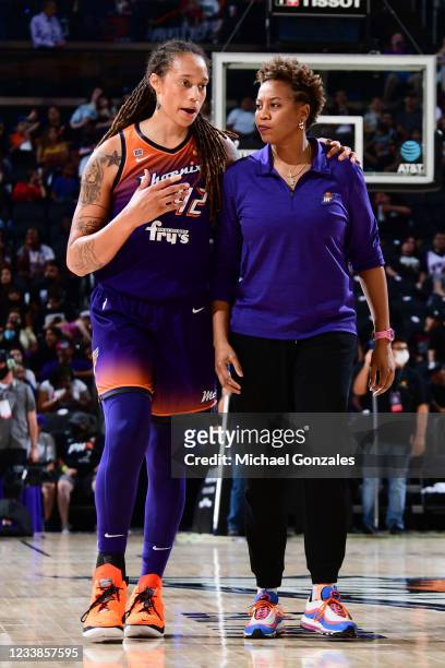 Assistant Coach Chasity Melvin of the Phoenix Mercury talks with Brittney Griner during the game against the Minnesota Lynx on July 3, 2021 at...