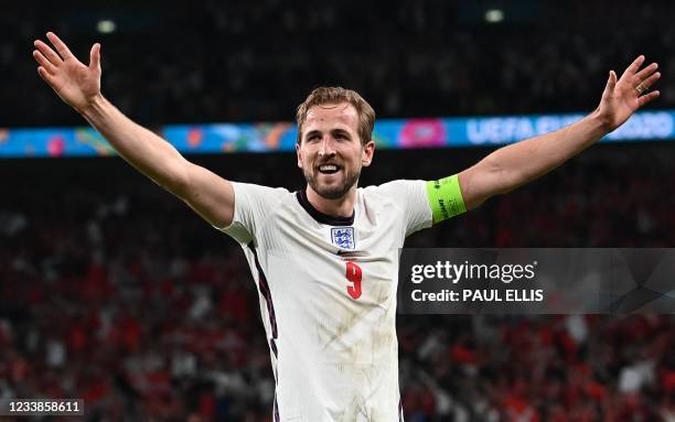 England's forward Harry Kane celebrates after winning during the UEFA EURO 2020 semi-final football match between England and Denmark at Wembley...