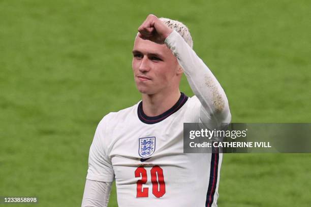 England's midfielder Phil Foden celebrates with the fans after their win in the UEFA EURO 2020 semi-final football match between England and Denmark...