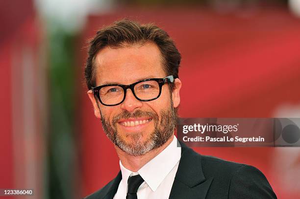 Actor Guy Pearce attends the "Mildred Pierce" premiere during the 68th Venice Film Festival at Palazzo del Cinema on September 2, 2011 in Venice,...