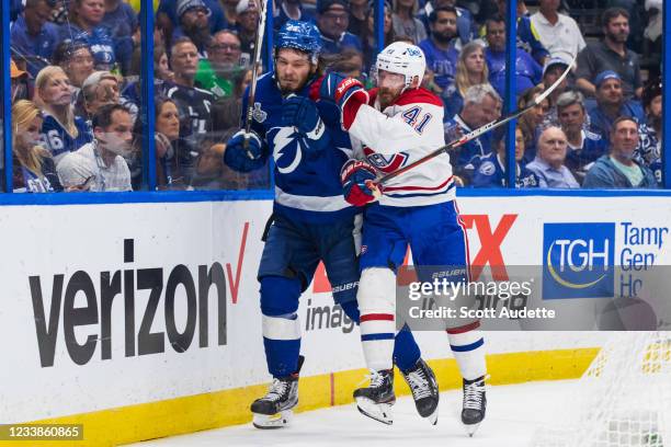 Mikhail Sergachev of the Tampa Bay Lightning skates against Paul Byron of the Montreal Canadiens during the second period of Game Five of the Stanley...