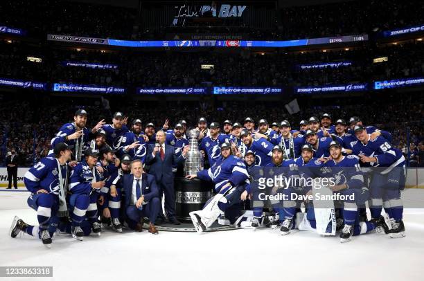 Commissioner Gary Bettman and Tampa Bay Lightning team stand around the Stanley Cup after the Lightning 1-0 victory in Game Five of the 2021 Stanley...
