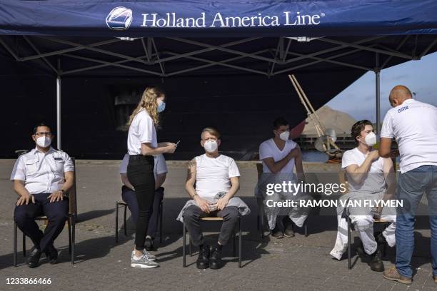 Cruise ship Oosterdam crew members receives a dose of the Janssen Covid-19 vaccine in IJmuiden on July 8, 2021 on the first day of coronavirus...