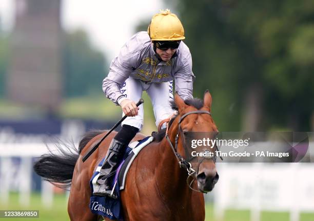 Lusail ridden by jockey Pat Dobbs on their way to winning the Tattersalls July Stakes during Ladies Day of the 2021 Moet and Chandon July Festival at...