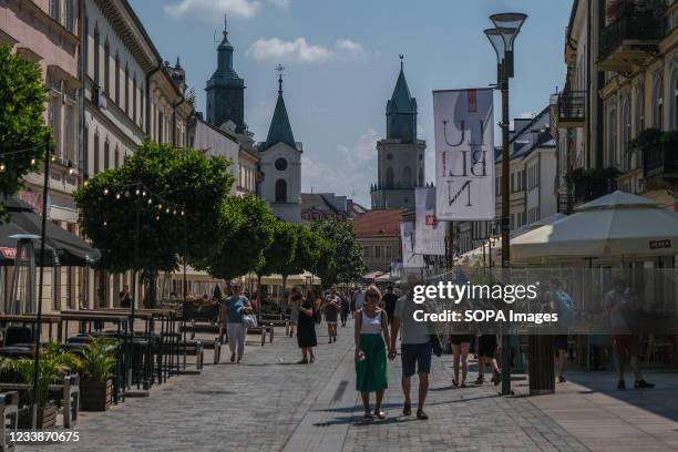 People seen walking on the old town road in summer as businesses continue to operate amid the Covid-19 pandemic.