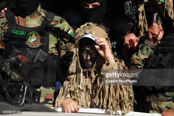 Young Palestinian during a graduation ceremony at a military summer camp organised by the Izz ad-Din al-Qassam brigade - the military wing of Hamas,...